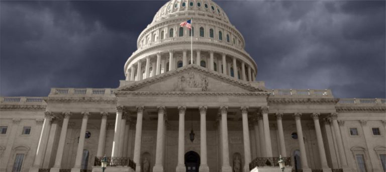 The dome of the United States Capitol against a grey sky