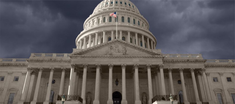 The dome of the United States Capitol against a grey sky