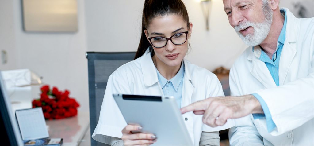 plain language summary graphic lay summary two doctors look at a tablet