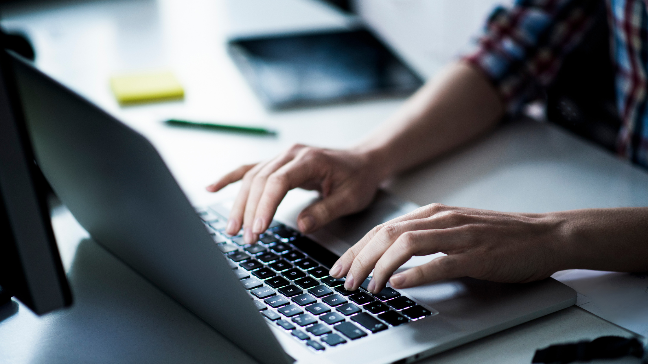 Typing on a laptop